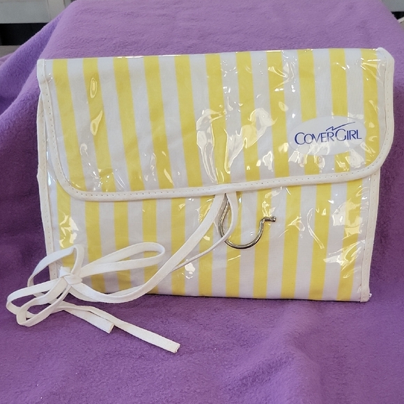 COVERGIRL Handbags - COVERGIRL Sunny Striped Cosmetic Case